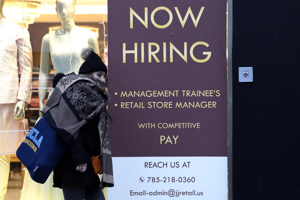 A hiring sign is displayed at a retail store in Chicago, Thursday, Jan. 5, 2023. (AP Photo/Nam Y. Huh)