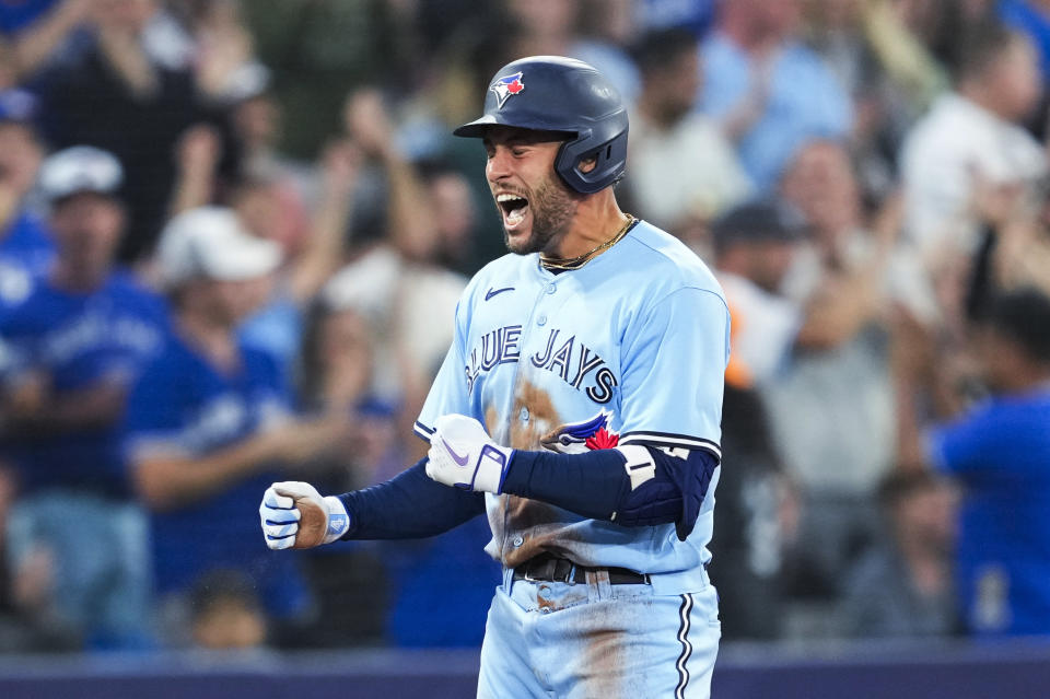 Toronto Blue Jays' George Springer celebrates his RBI double against the Minnesota Twins during the sixth inning of a baseball game Friday, June 9, 2023, in Toronto. Springer advanced to third on the play. (Mark Blinch/The Canadian Press via AP)