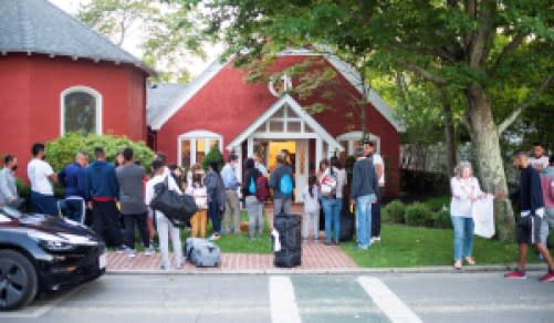 Venezuelan migrants stand outside St. Andrew’s Church in Edgartown, Mass., September 14, 2022.