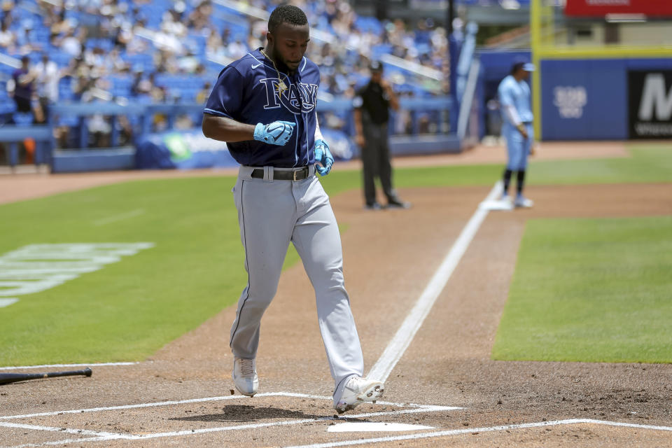 Tampa Bay Rays' Randy Arozarena scores against the Toronto Blue Jays during the first inning of a baseball game Sunday, May 23, 2021, in Dunedin, Fla. (AP Photo/Mike Carlson)