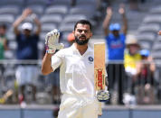 India's captain Virat Kohli reacts after scoring his century on day three of the second test match between Australia and India at Perth Stadium in Perth, Australia, December 16, 2018. AAP/Dave Hunt/via REUTER
