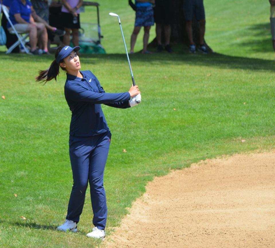 Xiaowen Yin pitches from just outside the bunker on the first playoff hole. Yin would go on and win the FireKeepers Casino Hotel Championship at Battle Creek Country Club on Sunday.