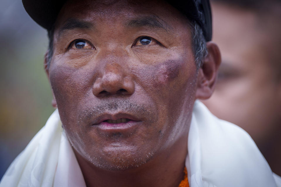 Veteran Sherpa guide Kami Rita, returning after scaling Mount Everest for the 28th time, arrives at the airport in Kathmandu, Nepal, on May 25, 2023. / Credit: Niranjan Shrestha / AP