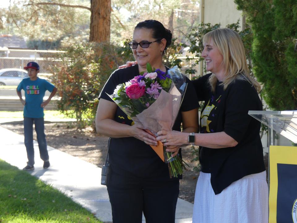 Sixth Street Prep Interim Principal Angela Bishop Cupp, right, recognizes Bilingual Instructional Assistant Veronica Venegas on her 22nd year anniversary at the historical school in Victorville.