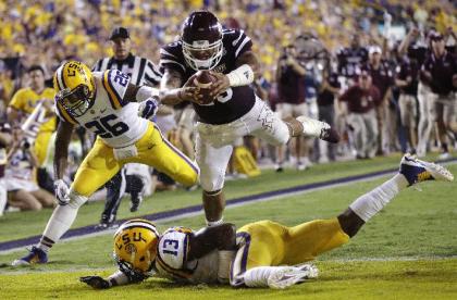 Dak Prescott (15) leaps into the end zone for a TD during the Mississippi State's 34-19 win over LSU. (AP)