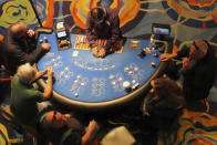 A dealer conducts a card game at the Ocean Casino Resort in Atlantic City N.J. on Dec. 2, 2022. On March 15, 2024, New Jersey gambling regulators released figures showing Atlantic City's nine casinos, the three horse tracks that accept sports bets, and their online partners won over $461 million in February, an increase of 12% from February 2023. (AP Photo/Wayne Parry)