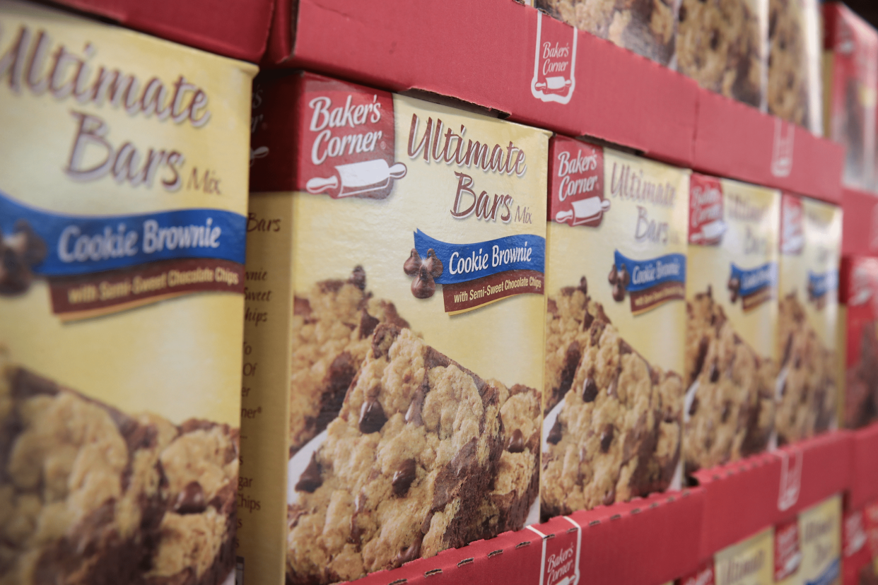 Closeup of row of Aldi branded brownie mix, Baker’s Corners Ultimate Bars, at Aldi, Chicago, each row on red cardboard