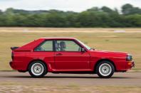 <p>Although immediately revered as a road car handling benchmark, Audi’s ur-quattro didn’t <em>quite</em> translate its prowess into the degree of deft nimbleness required for it to be an utterly dominant rallying weapon. Enter the gawky Sport quattro to the stage in 1984. </p><p>Using the shell of the 80 as its starting point — its more upright windscreen creating fewer <strong>dashboard reflections</strong> than the sleeker Coupé-based quattro — this was another low-volume homologation special, with just 224 produced. </p><p>Not only was power boosted to 302bhp, the Sport quattro’s shorter, wider bodywork made it look brutal, at least until you saw it side-on. Then the 320mm that had been chopped from the wheelbase — dropping the proportion of length to <strong>52.88%</strong> — became uncomfortably obvious. Still, you can’t see that when you’re Scandi flicking your way to the shops. </p>