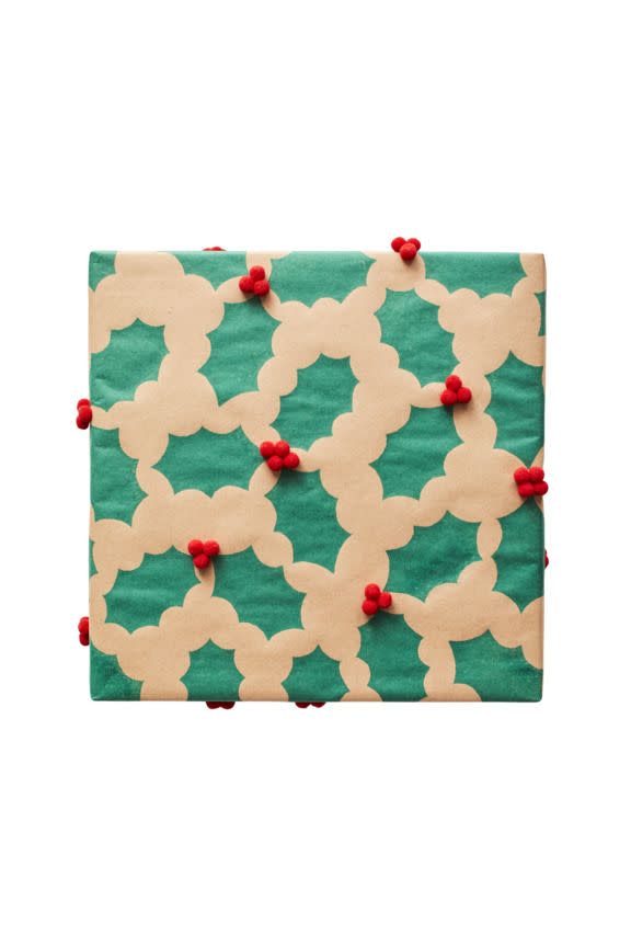 <p><strong>What you'll need:</strong></p><p>● Holly leaf stamp </p><p>● Red mini</p><p>● Green ink pad pom-poms </p><p>● Hot glue gun</p><ol><li>Coat the stamp with ink and press down hard on the butcher paper. Repeat all over the paper, making clusters of two or three leaves. Let dry. </li><li>Wrap your box, then hot-glue three or four pom-poms in the center of each leaf cluster.<br></li></ol>