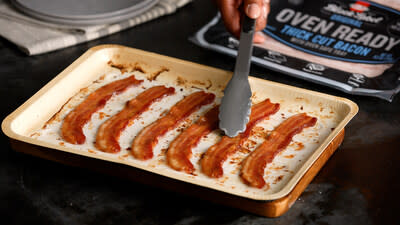 When finished, simply place the cooked slices of HORMEL® BLACK LABEL® OVEN READY™ Thick Cut Bacon onto a paper towel-lined plate, discard the tray in the trash, and enjoy!