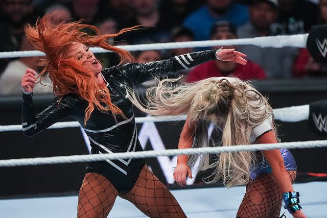 <p>Alex Bierens de Haan/Getty</p> Becky Lynch (left) and Liv Morgan in Houston, Texas on March 11, 2024