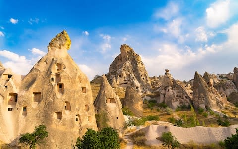 Stay in a cave hotel in Cappadocia - Credit: Getty