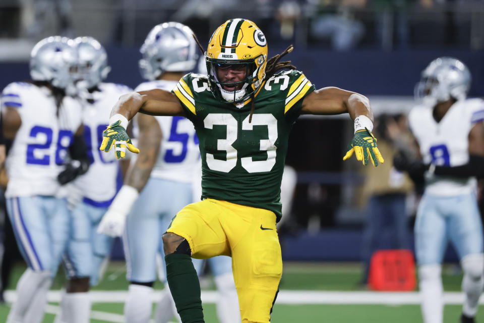 Green Bay Packers running back Aaron Jones reacts after a long run against the Dallas Cowboys during the second half of an NFL football game, Sunday, Jan. 14, 2024, in Arlington, Texas. (AP Photo/Michael Ainsworth)