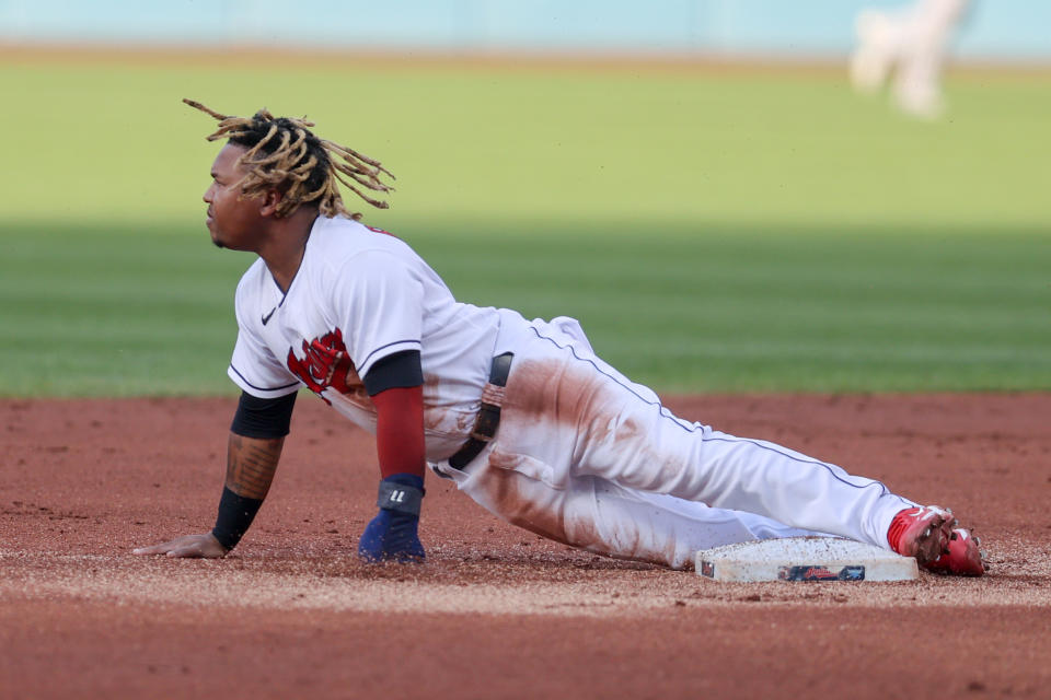 Cleveland's Jose Ramirez slides in safe after a stolen base in 2021. MLB is testing rules in the minor leagues that would limit the number of times pitchers can attempt to pick off runners. (Photo by Frank Jansky/Icon Sportswire via Getty Images)