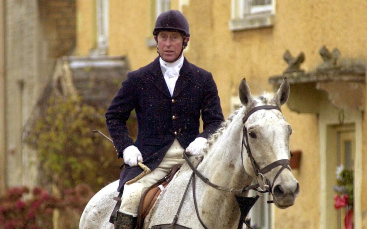 Prince Charles with the Duke of Beaufort's Hounds in 1999 - PA