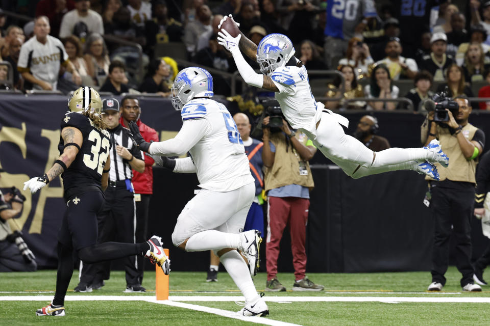 Detroit Lions wide receiver Jameson Williams dives to the endzone for a touchdown during the second half of an NFL football game against the New Orleans Saints, Sunday, Dec. 3, 2023, in New Orleans. (AP Photo/Butch Dill)