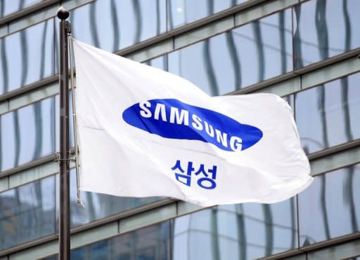 A flag bearing the Samsung logo flies outside the company's office in Seoul. South Korea's Samsung sought Monday to rally employees after a $1.05 billion US court judgment in favour of arch-rival Apple pushed its shares sharply lower amid fears about the fallout in the key American market