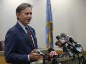 Oklahoma Attorney General Mike Hunter speaks to the media at a news conference following closing arguments in Oklahoma's ongoing opioid drug lawsuit against Johnson & Johnson Monday, July 15, 2019, in Norman, Okla. (AP Photo/Sue Ogrocki)
