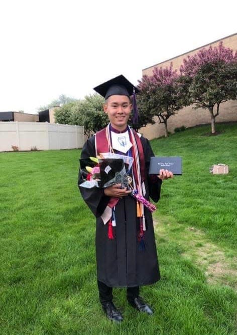 Phat Nguyen pictured following his high school graduation. Nguyen was a Michigan State University student in 2021 when he died during after a fraternity hazing event.