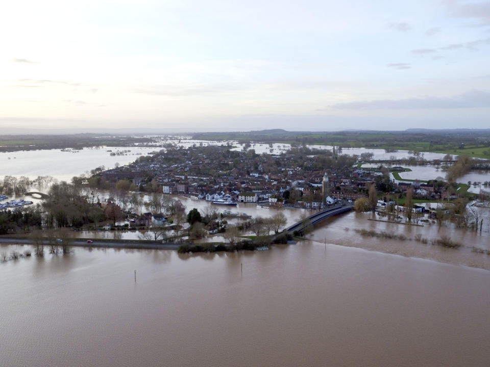 Flood water surrounds Upton upon Severn, England, Tuesday Feb. 18, 2020. Britain's Environment Agency issued severe flood warnings Monday, advising of life-threatening danger after Storm Dennis dumped weeks' worth of rain in some places. (Steve Parsons/PA via AP)