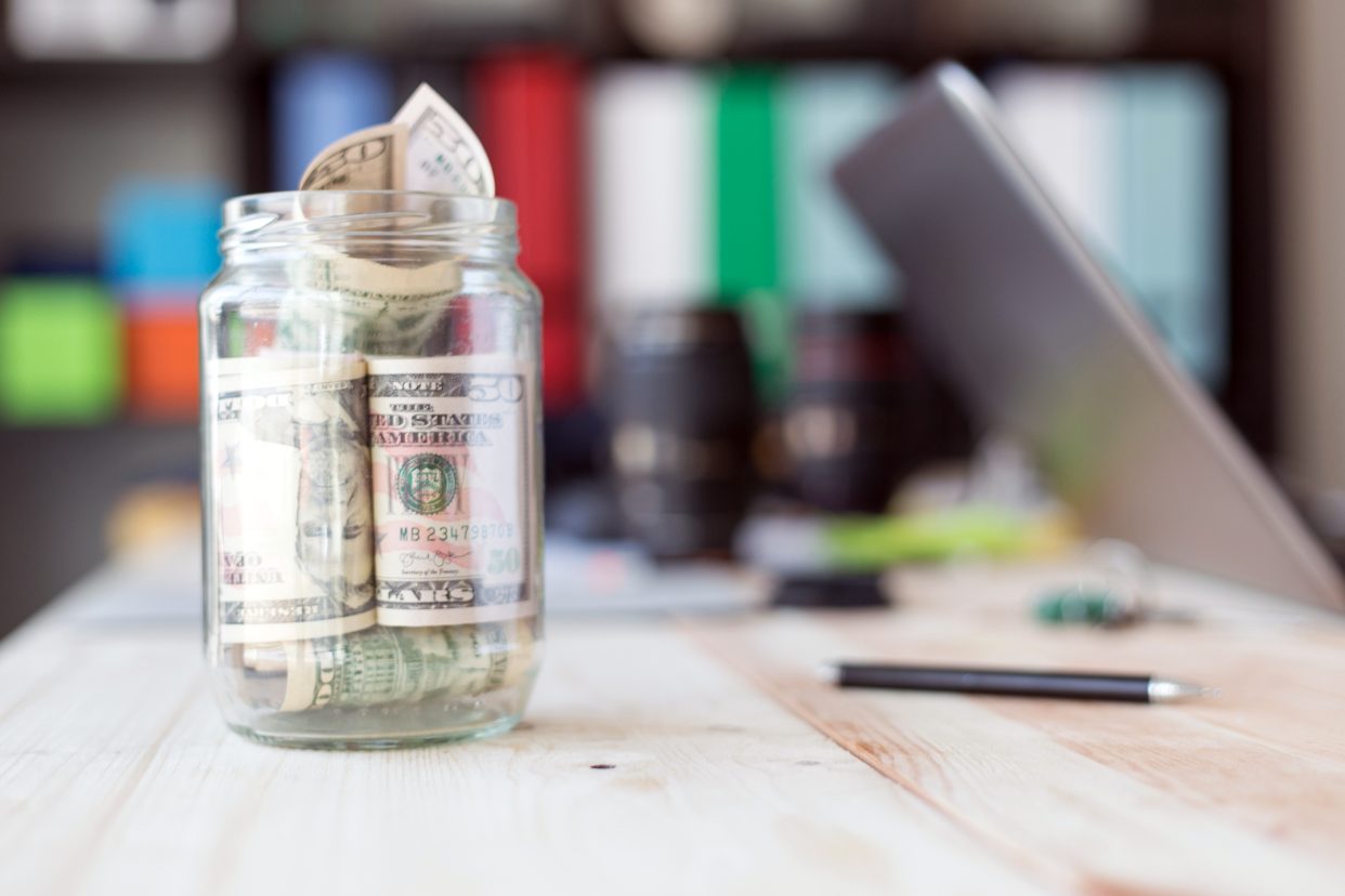 Jar of money on a desk