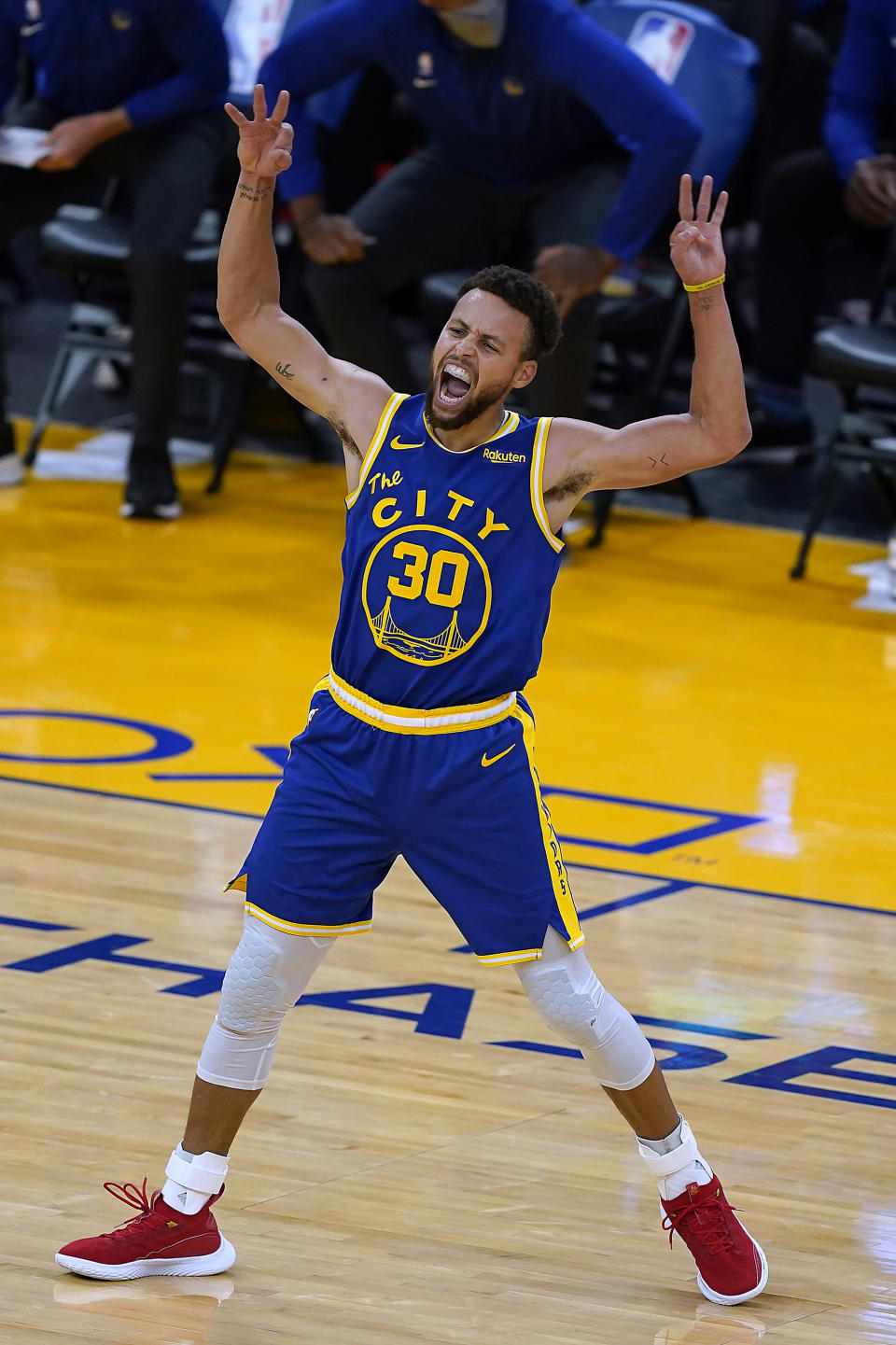 Golden State Warriors guard Stephen Curry celebrates after Andrew Wiggins made a 3-point shot against the Los Angeles Clippers during the second half of an NBA basketball game in San Francisco, Friday, Jan. 8, 2021. The Warriors won 115-105. (AP Photo/Tony Avelar)