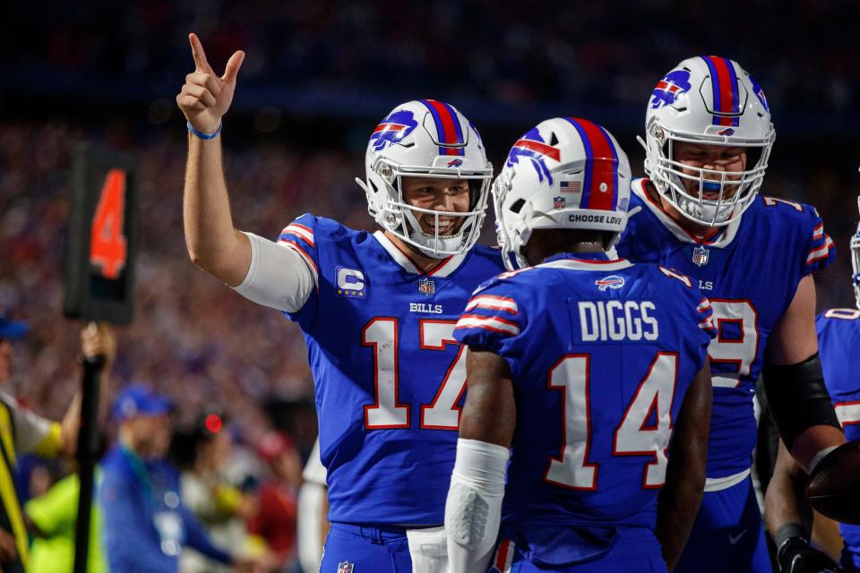 Buffalo Bills quarterback Josh Allen (17) celebrates with wide receiver Stefon Diggs (14) after connecting for a touchdown during an NFL football game, Monday, Sept. 19, 2022, in Orchard Park, NY. (AP Photo/Matt Durisko)