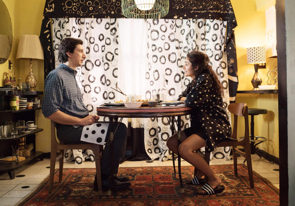 Adam Driver and Golshifteh sit at a table eating