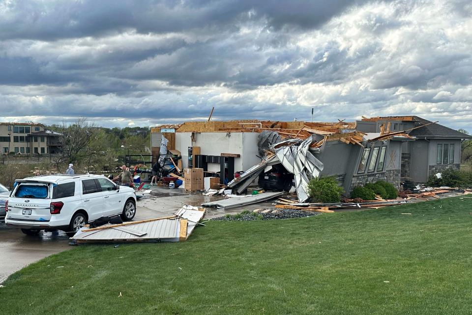 Damage is seen to a home after a tornado passed through the area near Bennington, Neb., Friday, April 26, 2024. (AP Photo/Josh Funk)