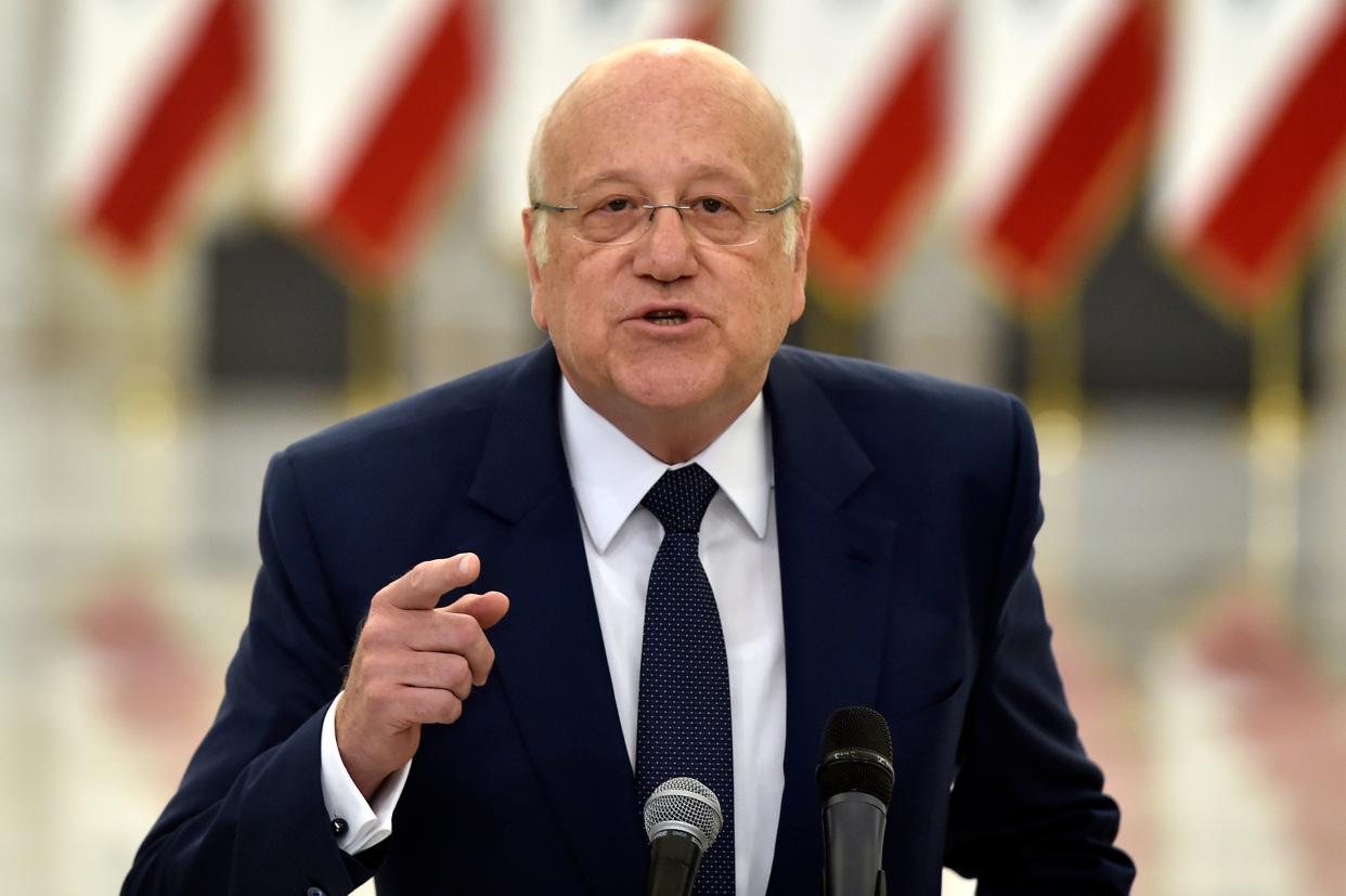 Prime Minister-designate Najib Mikati speaks to the media after his meeting with President Michel Aoun and assigned to form a new government (EPA)