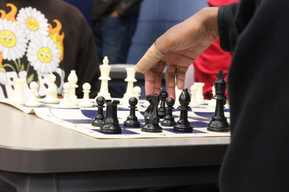 Clients of the Shelby County Youth and Family Resource Center learn how to play chess Tuesday, Jan. 24, 2022.