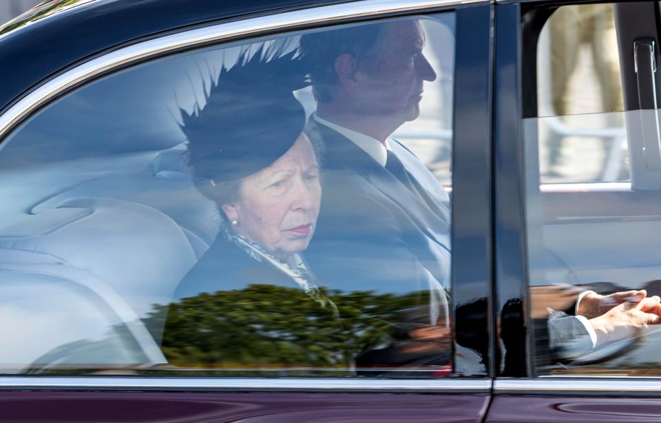 Princess Anne and her husband travel behind the hearse carrying the coffin of Queen Elizabeth II,