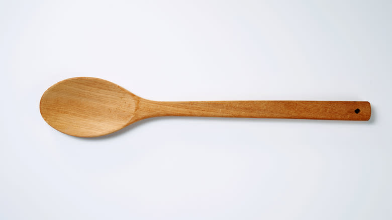 wooden spoon white background 