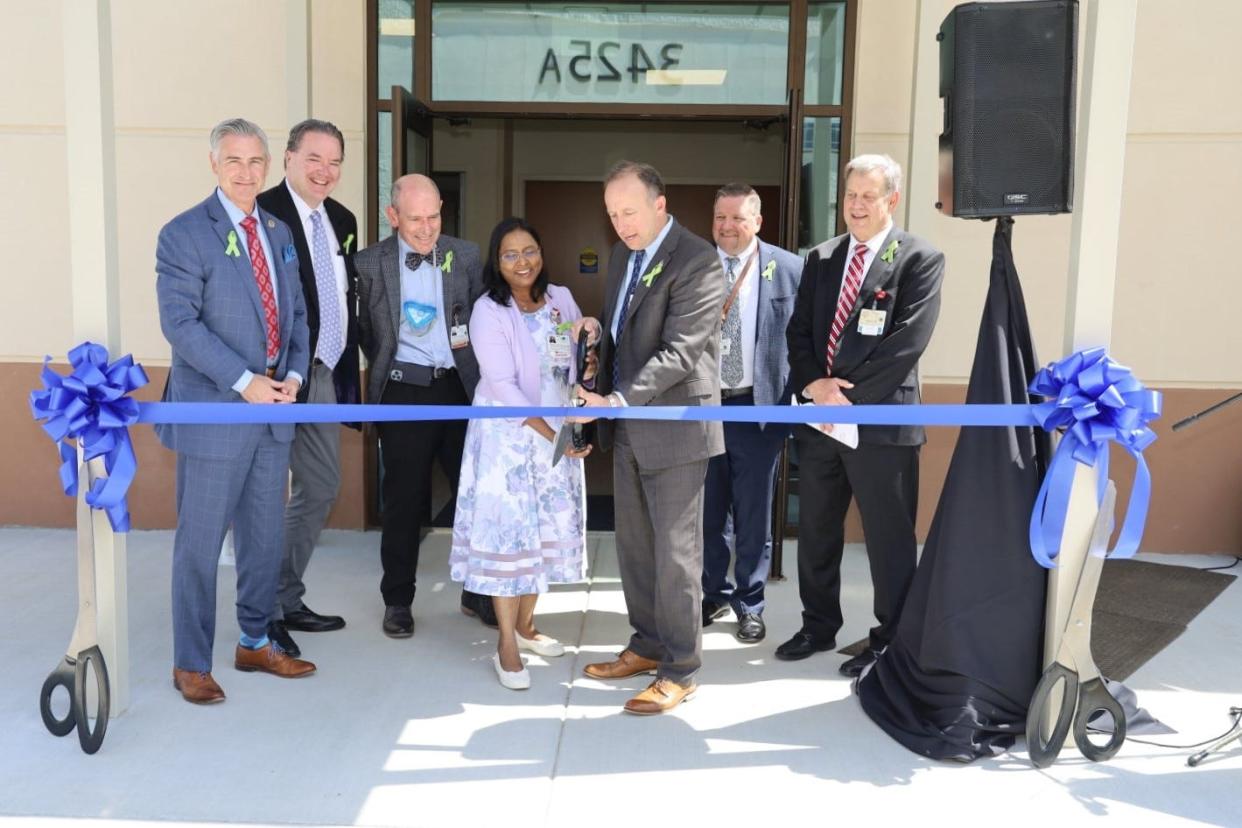 Dr. Sree Jadapalle, fourth from left, is a child and adolescent psychiatrist at Cape Fear Valley Medical Center. She participated in the ribbon-cutting ceremony for the grand opening of Dorothea Dix Adolescent Care Unit in March.