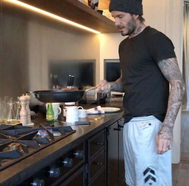 David Beckham seen cooking in the oh-so-chic kitchen. Source: Instagram
