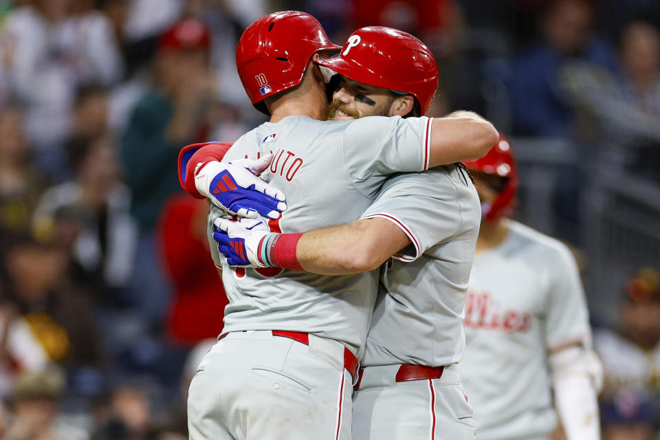 Philadelphia Phillies' Brandon Marsh, right, celebrates with J.T. Realmuto, left, after hitting a two-run home run during the third inning of a baseball game against the San Diego Padres, Friday, April 26, 2024, in San Diego. (AP Photo/Brandon Sloter)