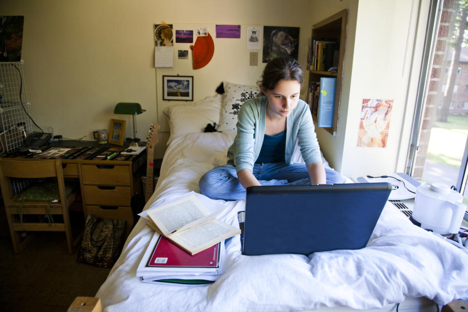 A student is studying in their dorm