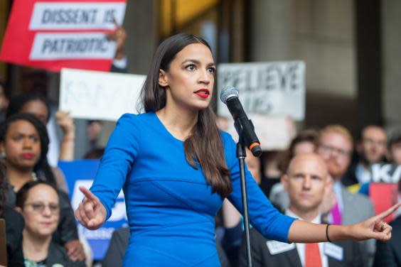 Alexandria Ocasio-Cortez speaks at a rally calling on Sen. Jeff Flake (R-AZ) to reject Judge Brett Kavanaugh's nomination to the Supreme Court on 1 October 2018 in Boston, Massachusetts (Getty Images)