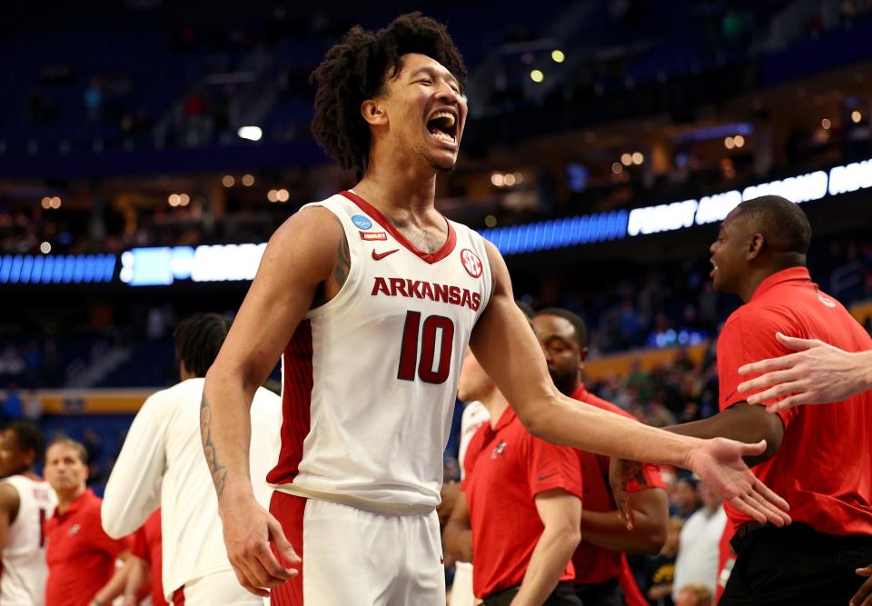 BUFFALO, NEW YORK - MARCH 19: Jaylin Williams #10 of the Arkansas Razorbacks celebrates the team's victory over the New Mexico State Aggies with a final score of 48-53 in the second round game of the 2022 NCAA Men's Basketball Tournament at KeyBank Center on March 19, 2022 in Buffalo, New York. (Photo by Elsa/Getty Images)