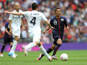 LONDON, ENGLAND - AUGUST 07: Hiram Mier of Mexico clears the ball as Hiroshi Kiyotake of Japan attempts to close down during the Men's Football Semi Final match between Mexico and Japan, on Day 11 of the London 2012 Olympic Games at Wembley Stadium on August 7, 2012 in London, England. (Photo by Julian Finney/Getty Images)