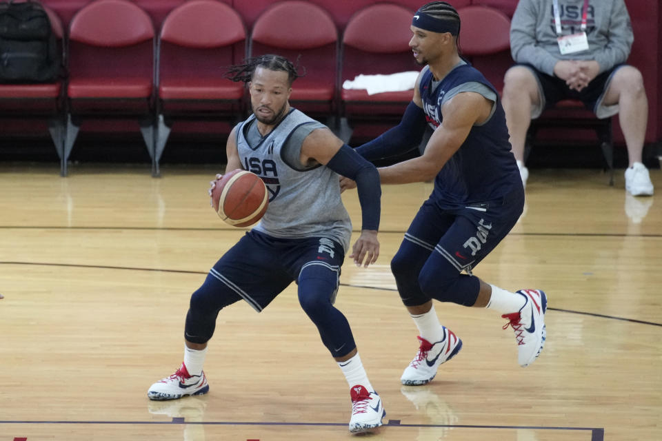 Jalen Brunson of the New York Knicks, left, drives around Josh Hart of the New York Knicks during training camp for the United States men's basketball team Thursday, Aug. 3, 2023, in Las Vegas. (AP Photo/John Locher)