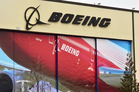 Boeing Co's logo is seen above the front doors of its largest jetliner factory in Everett, Washington, U.S. January 13, 2017. REUTERS/Alwyn Scott
