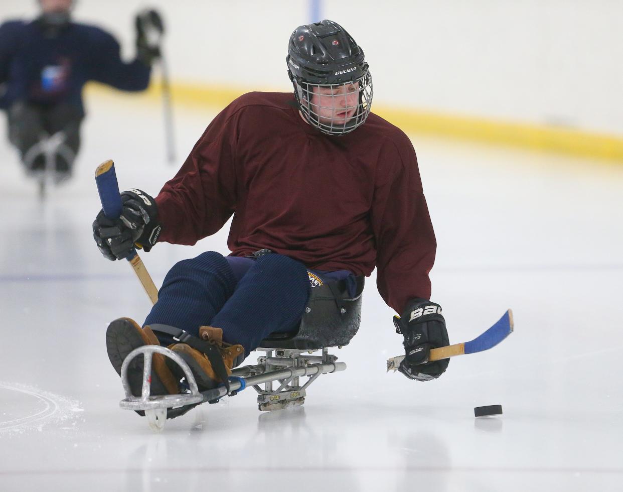 Canton Tuskies player Patrick Brennan moves the puck up ice during a practice at the Center Ice Sports Complex on Monday, Feb. 19, 2024.