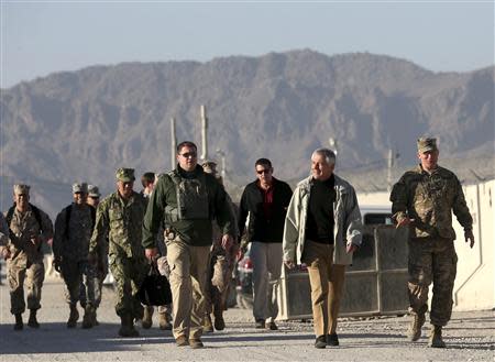 U.S. Defense Secretary Chuck Hagel (2nd R) walks to speak to U.S. troops at the Kandahar air base in Kandahar, Afghanistan December 8, 2013. REUTERS/Mark Wilson/Pool
