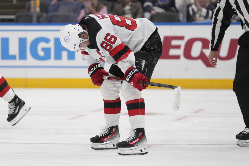 New Jersey Devils' Jack Hughes skates off the ice after slamming against the board during the first period of an NHL hockey game against the St. Louis Blues Friday, Nov. 3, 2023, in St. Louis. (AP Photo/Jeff Roberson)