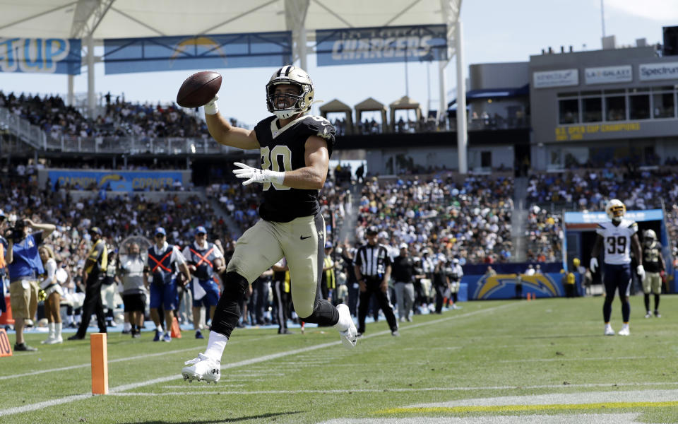 New Orleans Saints wide receiver Austin Carr, left, runs into the end zone for a touchdown during the second half of a preseason NFL football game against the Los Angeles Chargers, Sunday, Aug. 18, 2019, in Carson, Calif. (AP Photo/Gregory Bull )