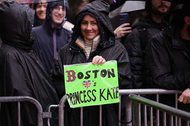 A woman holding a sign