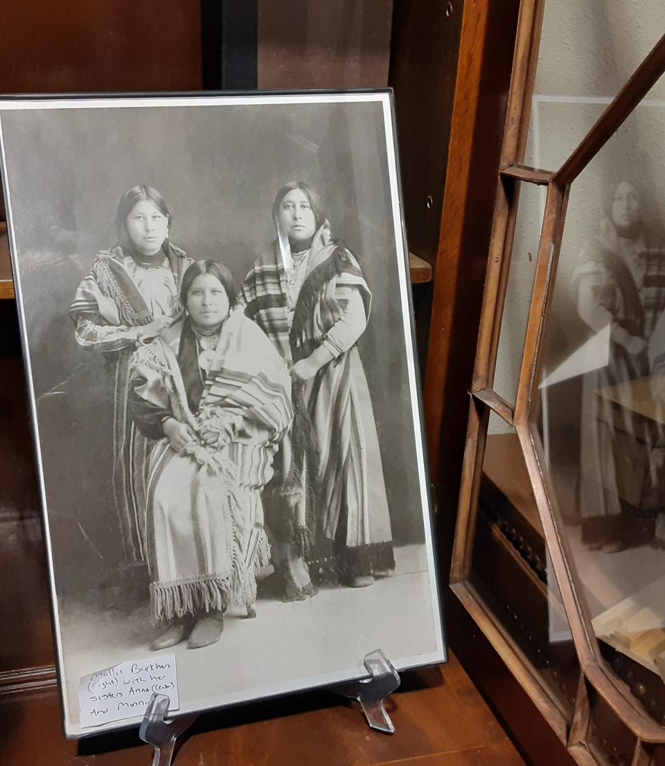 A photo of Mollie Burkhart and her sisters is displayed in 2021 inside the Osage-owned Water Bird Gallery in downtown Pawhuska. The gallery's owner, Danette Daniels, is moving it to nearby Fairfax in the hopes of revitalizing the town in the wake of the theatrical release of "Killers of the Flower Moon."