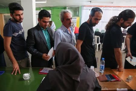 Voters arrive to cast their ballots during the presidential election in a Jewish and Christian district in the centre of Tehran, Iran, May 19, 2017. TIMA/via REUTERS