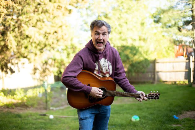 Farley plays a guitar at his home on Wednesday in Danvers, Massachusetts. Farley has so far tackled 46 states with his ongoing 